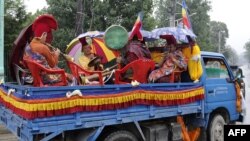 Nepalese monks playing instruments on a truck take part in a procession to mark the 9th International Everest Day in Kathmandu, May 29, 2016.