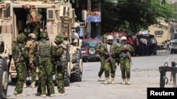 FILE - Kenyan police officers patrol as a part of a peacekeeping mission in Port-au-Prince, Haiti, July 17, 2024. 