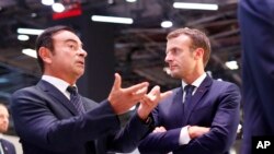 Fransa Cumhurbaşkanı Emmanuel Macron, Carlos Ghosn'u dinlerken (arşiv)