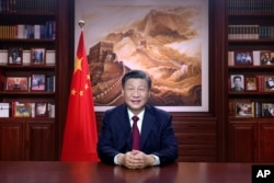 中国领导人习近平在发表新年讲话。（2022年12月31日）