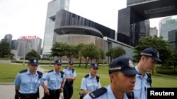 Police patrol outside the Legislative Council building in Hong Kong, June 11, 2019. 