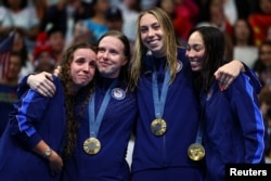 Swimming - Women's 4x100m Medley Relay Victory Ceremony