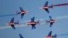 French aircrafts of the Patrouille de France spray colored smoke during a performance on the opening day of the Dubai Airshow in Dubai, United Arab Emirates.