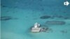 In this photo taken Feb. 28, 2013 by a surveillance plane, and released Thursday, May 15, 2014, by the Philippine Department of Foreign Affairs, Chinese-made structures stands on the Johnson Reef.