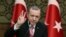 Turkey's President Recep Tayyip Erdogan gestures as he addresses local administrators, in Ankara, Turkey, Wednesday, Feb. 8, 2017. In a sign of ameliorating ties, Turkish officials said Wednesday that U.S. President Donald Trump looked "positively" on two