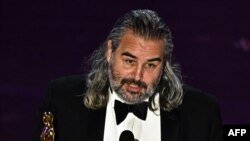 Dutch-Swedish cinematographer Hoyte van Hoytema accepts the award for Best Cinematography for "Oppenheimer" onstage during the 96th Annual Academy Awards at the Dolby Theatre in Hollywood, California on March 10, 2024.