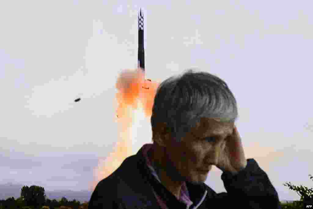 A man walks past a television screen showing a news broadcast with file footage of a North Korean missile test, at a train station in Seoul. North Korea fired a salvo of short-range ballistic missiles early on September 18, Seoul&#39;s military said, Pyongyang&#39;s second such weapons test in a week.&nbsp;