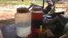 Rice wine on display in Damnak Ampil village in Pursat province, Cambodia, 2019. (Sun Narin/VOA Khmer)