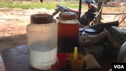 Rice wine on display in Damnak Ampil village in Pursat province, Cambodia, 2019. (Sun Narin/VOA Khmer)