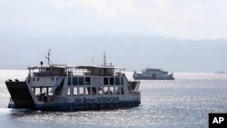 Ferry boats cross Bali Strait to carry Indonesians to Ketapang port, East Java, from Gilimanuk port, West Bali, Indonesia (File Photo - August 27, 2011).