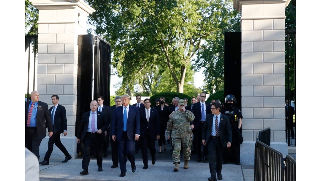 FILE - President Donald Trump walks from the gates of the White House to visit St. John's Church across Lafayette Park, June 1, 2020.