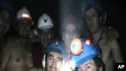 Trapped miners celebrate inside the San Jose mine in Copiapo, Chile