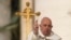 FILE—Pope Francis asperses holy water as he celebrates Easter mass in St. Peter's Square at the Vatican, March 31, 2024