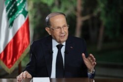 A handout picture provided by the Lebanese photo agency Dalati and Nohra shows Lebanon's President Michel Aoun speaking during a televised interview at the presidential palace in Baabda, east of the capital Beirut, Nov. 12, 2019.
