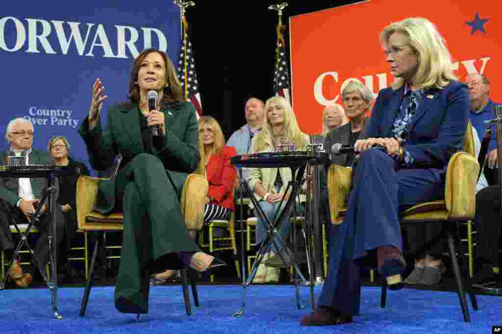 Democratic presidential nominee, Vice President Kamala Harris, left, speaks as former Republican Congresswoman Liz Cheney listens during a town hall at The People&#39;s Light in Malvern, Pennsylvania.