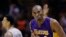 FILE - Los Angeles Lakers' Kobe Bryant (24) celebrates after he scored against the San Antonio Spurs during the second half of an NBA basketball game.