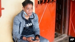 Fatoumata Yarie Camara, a Guinean freestyle wrestler scheduled to compete in the Tokyo Olympics, sits at her home in Conakry, Guinea, July 21, 2021.