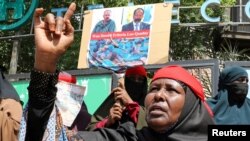 A woman reacts during a protest of Somali women who say their sons have been used as fighters in the Tigray conflict in neighboring Ethiopia, in Mogadishu, Somalia, June 10, 2021.