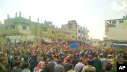 Protesters gather in a square in the southern city of Deraa,Syria April 8, 2011