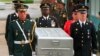 FILE - U.N. honor guards carry a coffin containing the remains of an American soldier after they were returned by North Korea, at the border village of Panmunjom, South Korea, May 14, 1999.