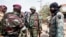 Lieutenant-Colonel Issiaka Ouattara, named Wattao, and Lieutenant-Colonel Cherif Ousmane greet mutinous soldiers, at the airport in Bouake, Ivory Coast, Jan. 13, 2017. 