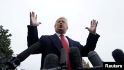 FILE - U.S. President Donald Trump talks to reporters from the South Lawn of the White House in Washington, Nov. 9, 2018.