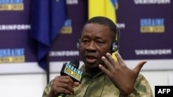 FILE—A man from Sierra Leone made prisoner of war after being captured by Ukraine as a foreign combattant within the Russian armed forces, takes part in a press conference organised by Ukrainian officials in Kyiv, on March 15, 2024.