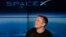 FILE- Elon Musk, founder, CEO, and lead designer of SpaceX, speaks at a news conference after the Falcon 9 SpaceX heavy rocket launched successfully from the Kennedy Space Center in Cape Canaveral, Florida on Feb. 6, 2018.