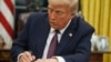 FILE - U.S. President Donald Trump signs an executive order on birthright citizenship in the Oval Office of the White House in Washington on Jan. 20, 2025.