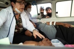 Injured demonstrators inside an ambulance in Sacaba, on the outskirts of Cochabamba, Bolivia, Nov. 15, 2019.