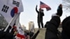 Pro-Yoon supporters rally near Seoul Western District Court in Seoul, on Jan. 18, 2025, while the court weighs whether to extend the detention of impeached South Korea President Yoon Suk Yeol. On Sunday, the court issued a warrant allowing Yoon's extended detention.