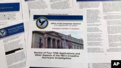 The report issued by the Department of Justice inspector general is photographed in Washington, Dec. 9, 2019. The report on the origins of the Russia probe found no evidence of political bias, despite performance failures.