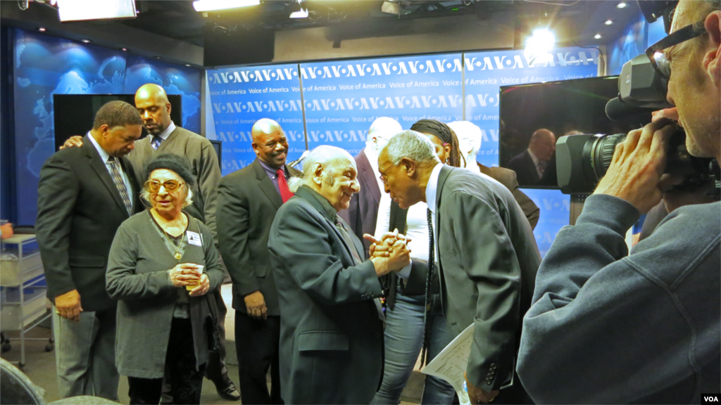 Negussie Mengesha, Africa Division Program Manager, greets Leo Sarkisian during the studio dedication ceremony.