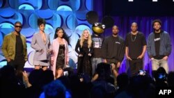 (L-R) Usher, Rihanna, Nicki Minaj, Madonna, Deadmau5, Kanye West, JAY Z, and J. Cole onstage at the Tidal launch event #TIDALforALL at Skylight at Moynihan Station on March 30, 2015 in New York City. 