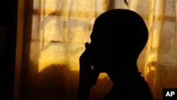 The silhouette of an 18-year-old South African orphan, whose mother died of AIDS when he was 14 (file photo)