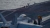 Arquivo: Nesta fotografia divulgada pela Marinha dos EUA, um F/A-18 Super Hornet prepara-se para descolar do convés de voo do porta-aviões da classe Nimitz USS Theodore Roosevelt, a 5 de julho de 2024, no Mar do Sul da China.