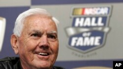 Former NASCAR driver and owner Junior Johnson smiles as he speaks to media about being named to the NASCAR Hall of Fame during a news conference at Lowe's Motor Speedway in Concord, N.C., Oct. 16, 2009. 