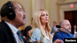 Reality television star Paris Hilton testifies during a U.S. House of Representatives committee hearing on the abuse of youth in residential treatment facilities, in Washington on June 26, 2024. 