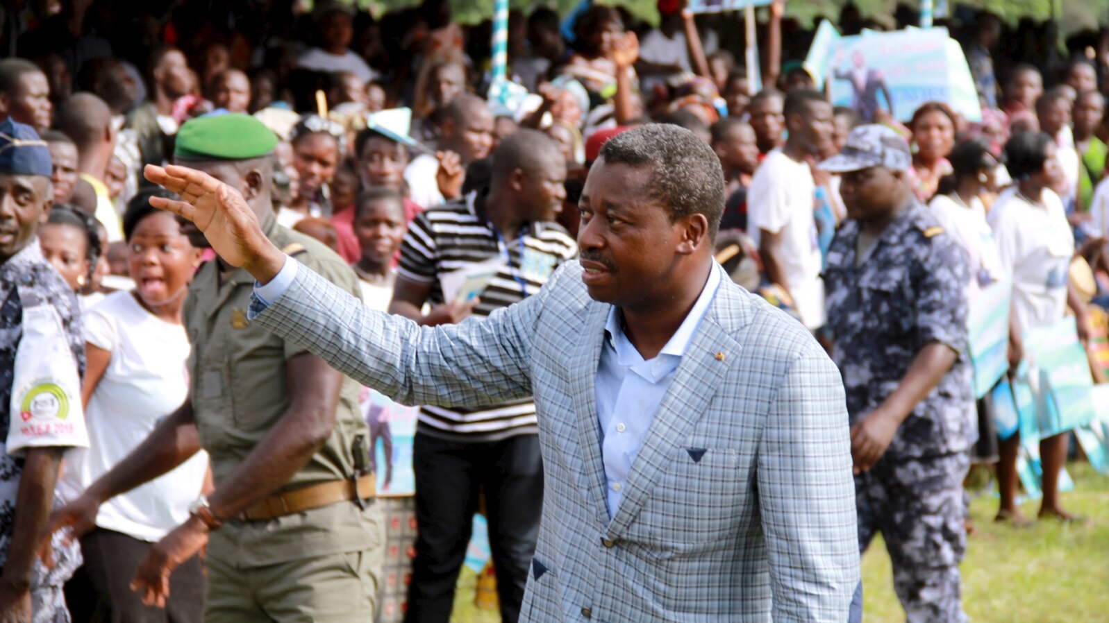Incumbent President Faure Gnassingbe, who is running for a third term, waves to a crowd at a campaign rally in Tado, Togo, April 13, 2015.