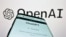 手机屏幕上显示的ChatGPT应用程序，背景为OpenAI公司的标志。