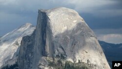 FILE - This August 2011 photo shows Half Dome and Yosemite Valley in a view from Glacier Point at Yosemite National Park, Calif.