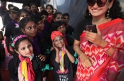 Children prepare for a play to bring awareness of violence against women and children during the "One Billion Rising Campaign" in New Delhi, Feb. 9, 2020. One Billion Rising is a global campaign to demand violence against women and girls ends.