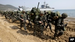 South Korean Marines take part in a landing exercise during joint US-South Korean military training last year. This year's exercises known as Key Resolve and Foal Eagle are expected to be the largest ever.