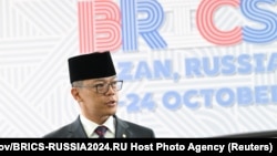 FILE - Indonesia's Foreign Minister Sugiono arrives at the BRICS summit in Kazan, Russia, Oct. 24, 2024. 