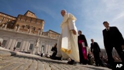 Pope Francis is seen arriving in St. Peter's Square at the Vatican May 13, 2015.