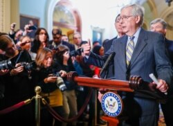 FILE - U.S. Senate Majority Leader Mitch McConnell speaks to Capitol Hill reporters following the weekly Senate Republican policy lunch at the U.S. Capitol in Washington, Jan. 14, 2020.