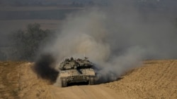 
Israel Palestinians
FILE - Israeli soldiers drive a tank near the Israeli-Gaza border, in southern Israel, Wednesday, June 5, 2024. Israel's military said Saturday June 15, 2024 that eight soldiers were killed in southern Gaza in the deadliest attack on Israeli forces in months. (AP Photo/Tsafrir Abayov, File)