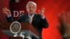 FILE - Mexican President Andres Manuel Lopez Obrador answers questions from journalists at his daily press conference at the National Palace in Mexico City, March 8, 2019.