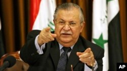 FILE - Then Iraqi president Jalal Talabani talks to reporters in Baghdad, Iraq, Aug. 17, 2007. Talabani died Tuesday in a Berlin hospital at age 83.