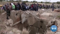 South African police try to force illegal miners from disused shaft